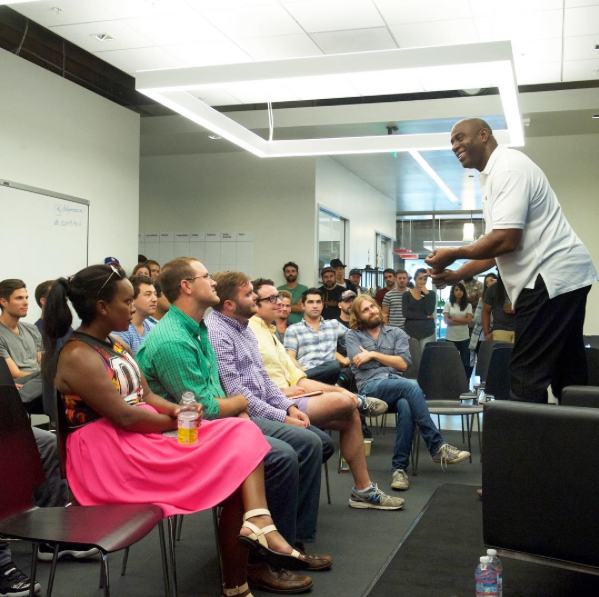 Magic Johnson speaking to hopeful entrepreneurs at the Dodgers Accelerator. Image from the Dodgers Accelerator Instagram